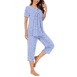 Stylish women's blue dot print pajama set featuring a buttoned round neck and pants