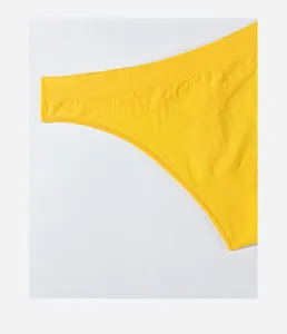 Macro view showing the seamless texture and wide waistband of yellow thong