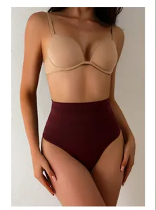 Close-up of high-waisted burgundy tummy control shapewear showing fabric texture