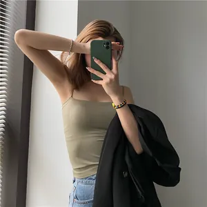 Detailed mirror selfie showing a seamless olive green camisole for women on an Asian model