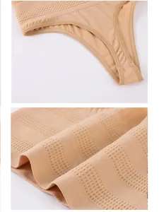 Detailed macro view of beige tummy control thong showcasing breathable knitted fabric texture