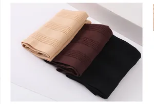 Detailed view of mid-waist shapewear thongs in beige, brown, and black colors.