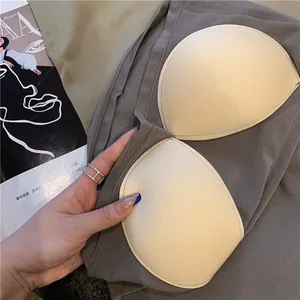 Close-up detail of soft breathable fixed chest pads in a seamless grey camisole bralette