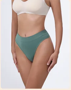 Detailed view of women's seamless green thong with wide waistband for fitness and yoga