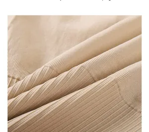 Close-up of the breathable ribbed fabric on a high-elasticity body shaping bodysuit.