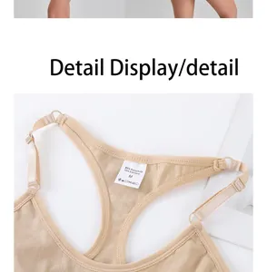Close-up detail view of a beige shapewear bodysuit featuring wash label and back straps