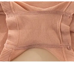 Detail view of the breathable ribbed fabric and flatlock seams on peach safety underwear