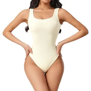 Seamless ribbed bodysuit for yoga and fitness, slimming cream-colored onesie for women.