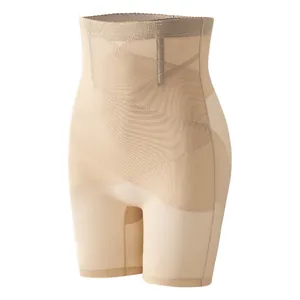 High-waisted mesh tummy control shapewear shorts in nude with a functional criss-cross design.