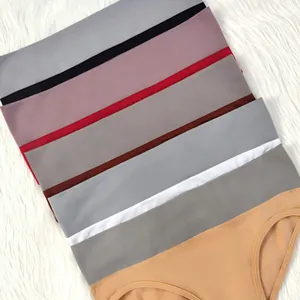Detailed view of seamless women's panties in multiple colors on white fur background
