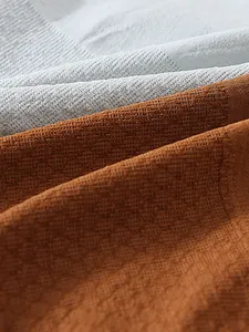 Close-up of 3D honeycomb texture on seamless high-waisted panties fabric.