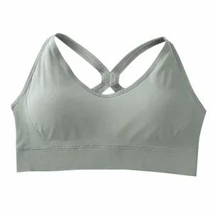 Sage green plus size seamless sports bra with racerback design for yoga and fitness