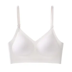 Front view detail showing the seamless fabric and thin adjustable straps of the white bra