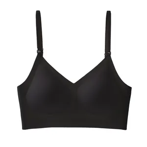 Detail of a seamless black backless bra featuring adjustable thin straps and a U-shaped design