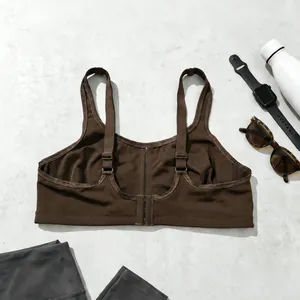 Detailed back view of a brown plus size sports bra with adjustable straps and closure.