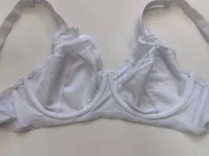 Detailed view of white plus size ultra-thin bra with elegant lace patchwork trim.
