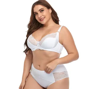 Elegant plus size white lace bra and high-waist panty set on a smiling model