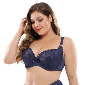 Close-up detail of navy blue lace bra featuring intricate floral patterns and thin cups