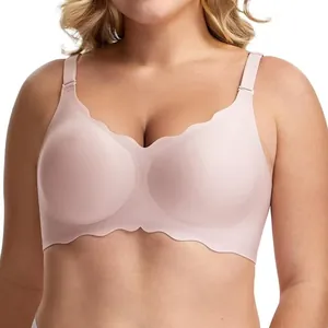 Professional detail shot of a seamless wire-free plus size bra with scalloped wave edges