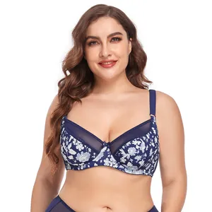 Detailed view of a blue floral print plus-size bra with mesh lace trim worn by model