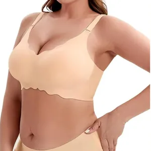 Close-up detail of nude seamless plus size bra with wavy scalloped edges and soft support