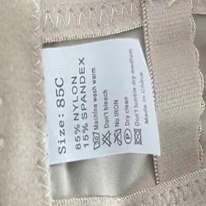 Close-up of garment wash label showing size 85C and material composition details