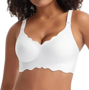 Detailed view of white wireless plus size seamless bra featuring scalloped edge design