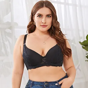 Detail shot of a black lace plus size bra with delicate floral patterns and bow.
