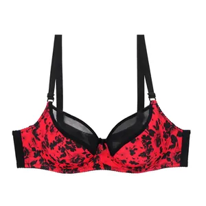 Detailed view of red and black floral print bra with mesh splicing and adjustable straps