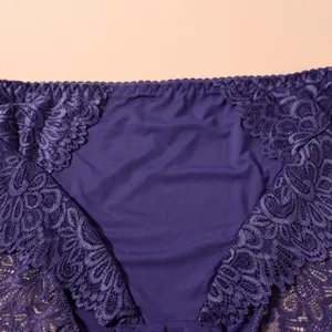 Close-up detail of dark purple floral lace and smooth fabric on women's underwear