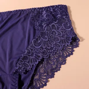 Detailed macro view of delicate purple floral lace on high-waist women's panties