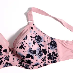Close-up detail of pink floral print thin cup bra featuring dark flower patterns and strap