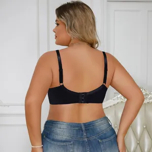 Back view detail of a black plus-size lace bra with adjustable straps and hook-and-eye closure.