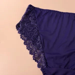 Close-up detail of dark blue high waist lace panties with floral embroidery