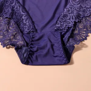 Detail shot of purple lace underwear with delicate floral patterns and cotton lining.