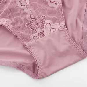 Detailed macro view of pink lace and elastic fabric on high-waist women's panties