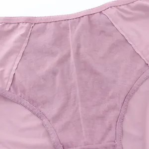 Detailed macro view of the mauve mesh fabric and delicate lace trim on high waist panties