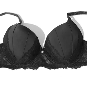 Detailed close-up view of a black lace push-up bra with bow and rhinestone center accent