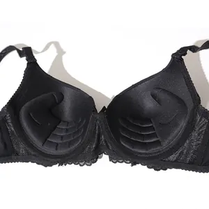 Detailed view of black push-up bra cups featuring unique hand-shaped inner padding