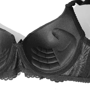 Detail of push-up bra interior showing hand-shaped padding and lace trim