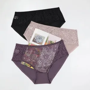 Detailed view of intricate lace pattern on three pairs of sexy transparent briefs