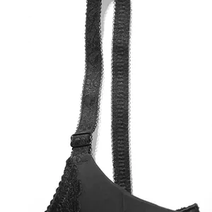 Close-up of black lace bra strap with adjustable slider and delicate textured embroidery