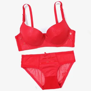 Detailed view of a sexy red PU leather push-up bra and sheer mesh panty lingerie set