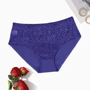 Detail of sexy purple lace mid-waist panties with floral embroidery pattern for women.