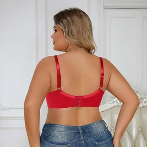 Rear view of a red plus size lace gathered bra with adjustable straps and hooks.