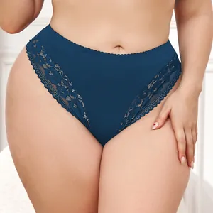 Close-up of plus size navy blue lace trim panties with comfortable mid-waist cotton design