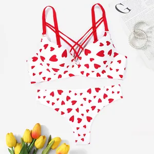 Close-up of white seamless bra and panty set with cute red heart print patterns