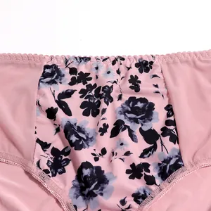 Close-up of floral print and mesh fabric detail on pink plus size panties