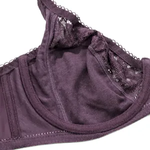 Close-up detail of purple lace plus size bra showing delicate stitching and soft fabric.