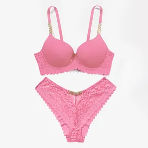Sexy pink lace lingerie set featuring sparkling rhinestone chain straps and push-up bra